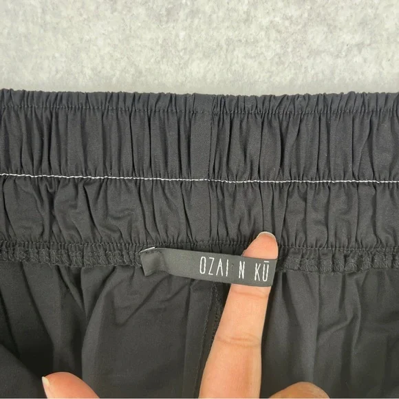 Ozai N Ku Wide Leg Pants Ribbon Appliqué Asymmetric Cutout Hem Zip Elastic Waist - Picture 4 of 16